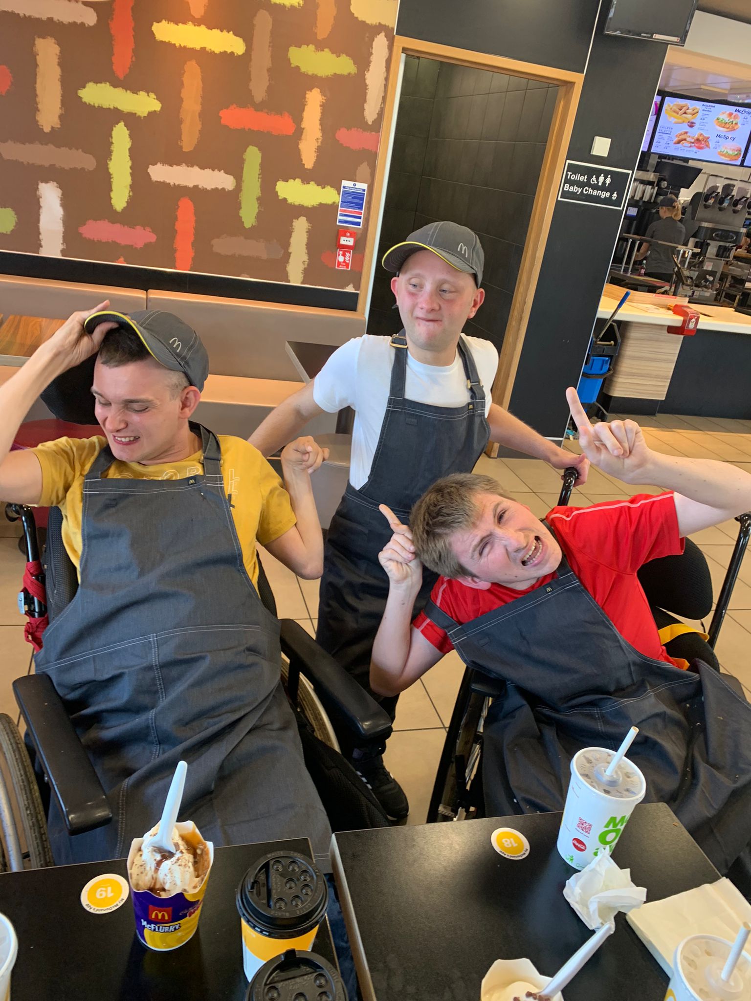 Three people enjoying a meal at a restaurant