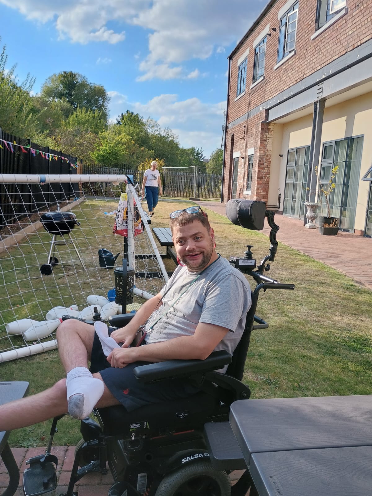 Person in wheelchair in their garden
